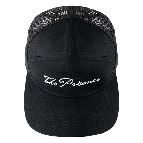 The Prisoner 7-Panel Trucker Hat with logo on front