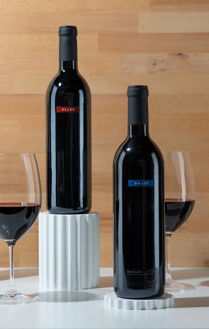 2 bottles of saldo red blend wine, 2 bottles of saldo zinfandel wine, 2 wine glasses