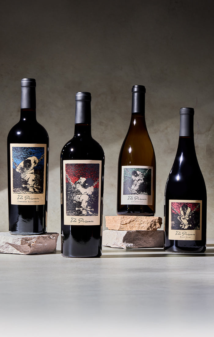 image of 4 wine bottles. The prisoner Cabernet Sauvignon, the prisoner red blend, the prisoner chardonnay, and the prisoner pinot noir