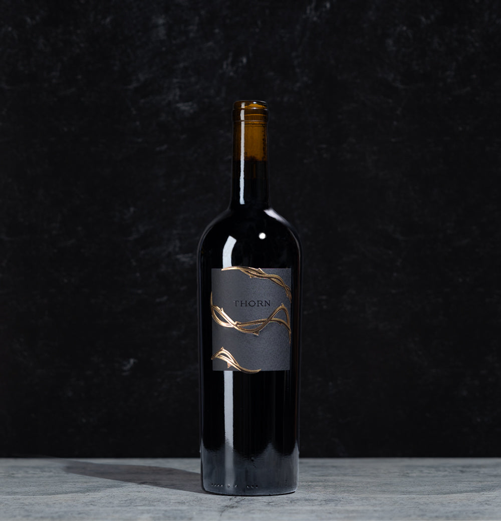Thorn Merlot bottle of wine on a black background