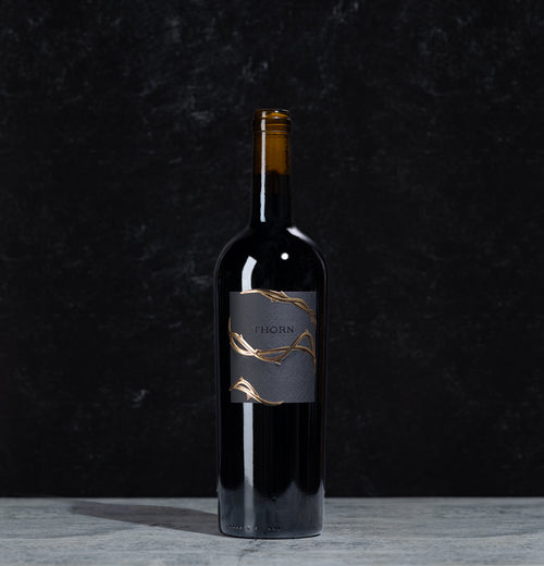 Thorn Merlot bottle of wine on a black background