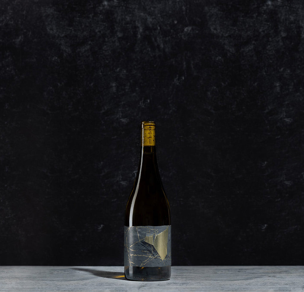 bottle of the white wine bottle Friction on a black background 