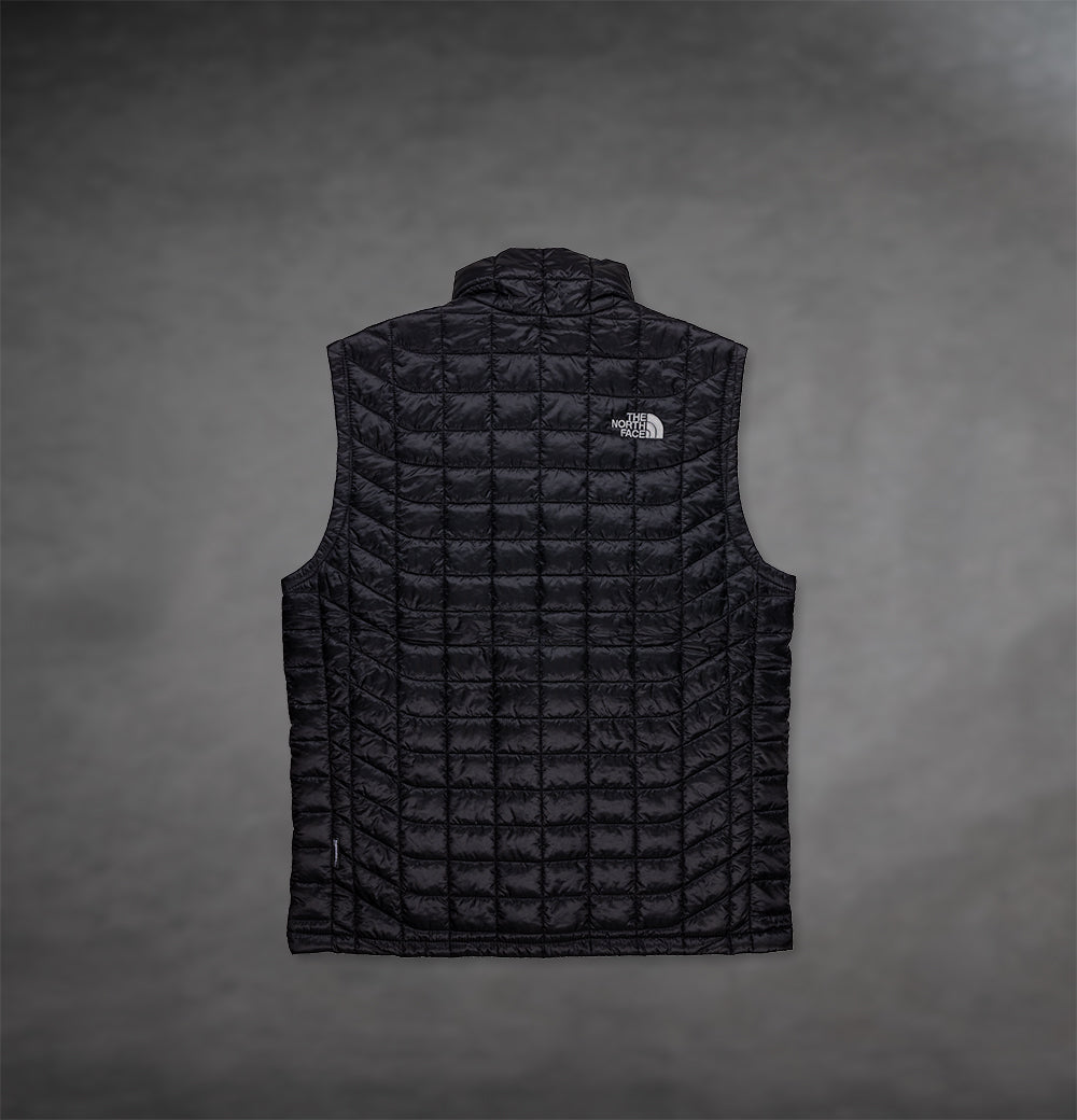 Back of Black North Face Vest by The Prisoner with logo on front right 