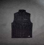 Front of Black North Face Vest by The Prisoner with logo on front right 