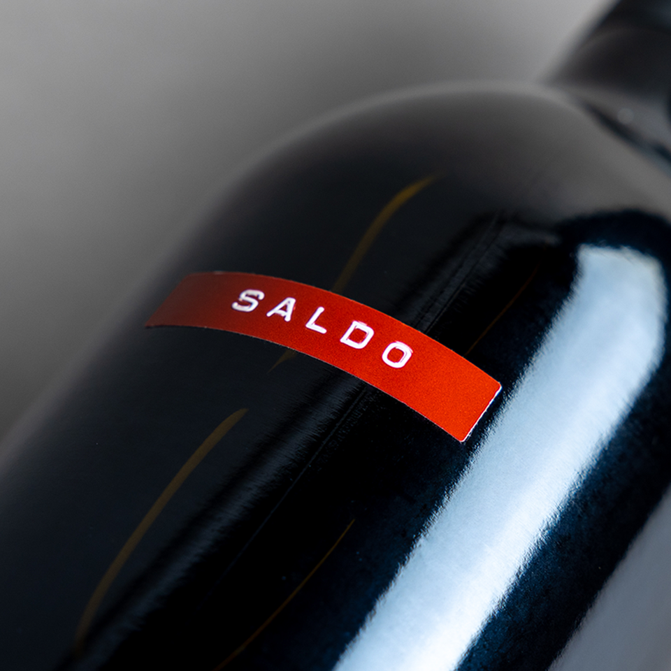 Bottle of SALDO Zinfandel zoomed in on red label
