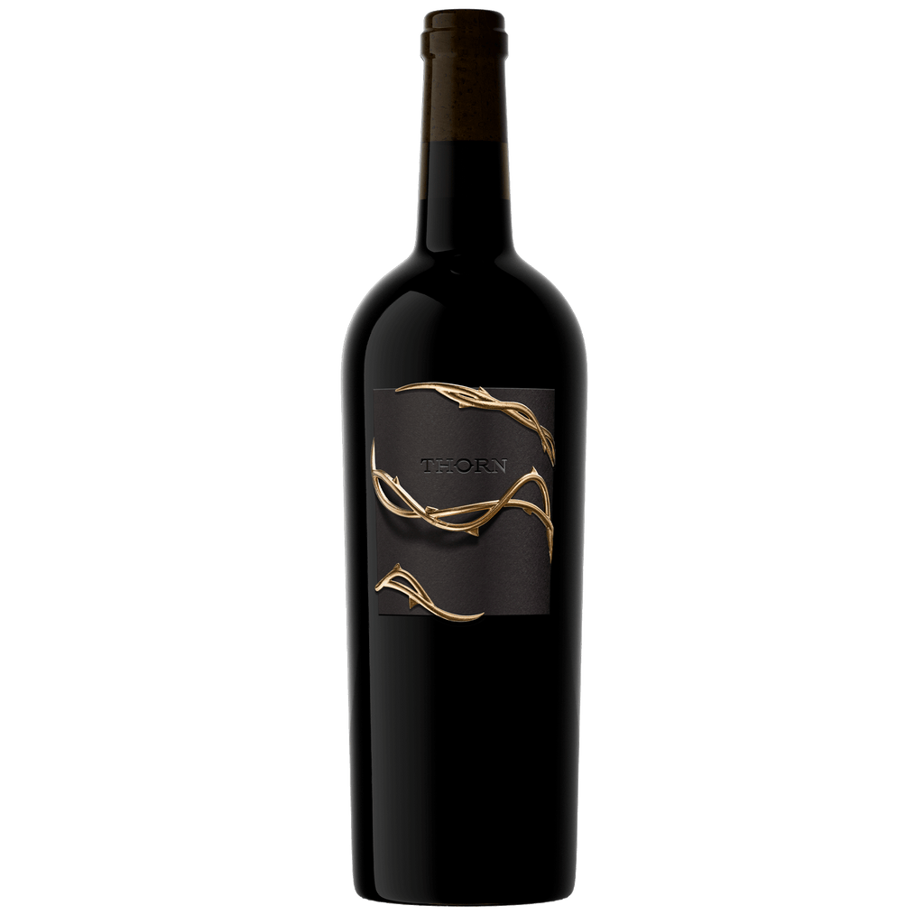 A dark glass wine bottle with a black label featuring a gold vine design and the brand name THORN, set against a plain white background.