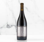 Unshackled Pinot Noir bottle on a white background