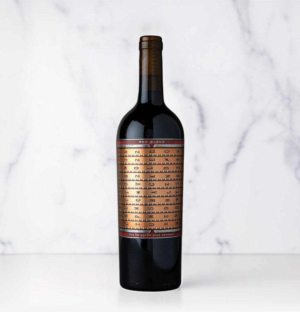 A bottle of 2022 UNSHACKLED Red Blend wine from California against a light background