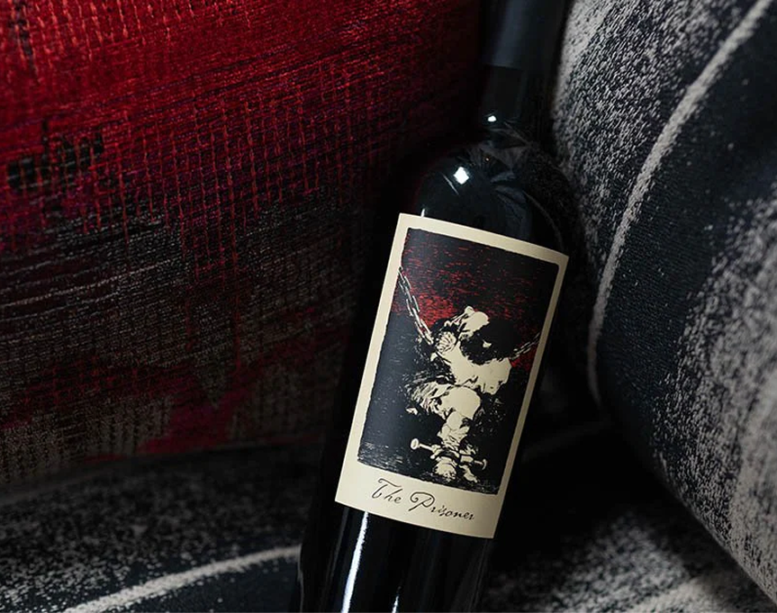 The Prisoner bottle on a couch