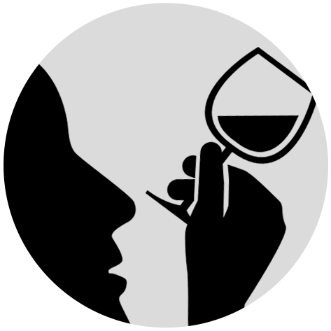 The silhouette of a person looking at a wine glass.