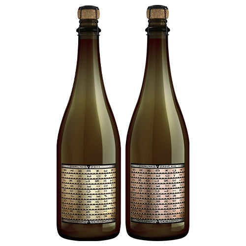 Two bottles of sparking wine in white background. 